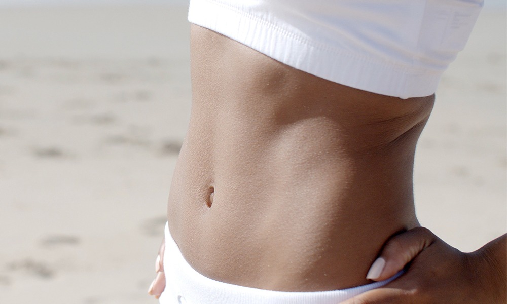 Get a Swimsuit-Ready Body with a Tummy Tuck banner